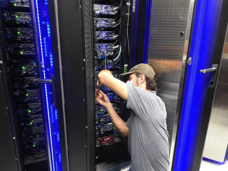 Member of the ARC team working on a computer server.